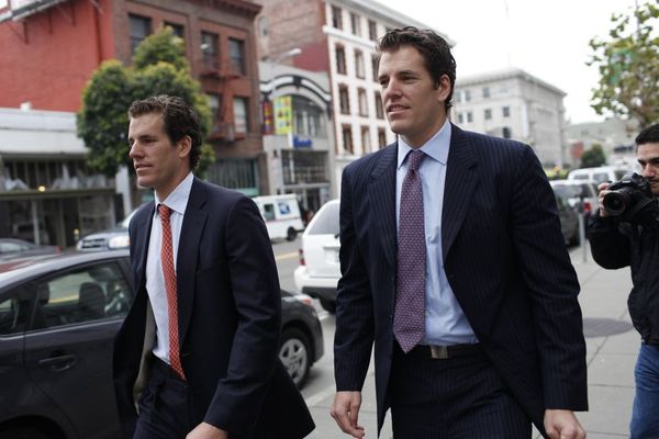 Cameron Winklevoss (L) and his brother Tyler leave the 9th Circuit Court of Appeals after a hearing on a settlement dispute with Facebook's Mark Zuckerberg in San Francisco, California in this January 11, 2011 file photo. The twin brothers who accused Facebook Inc and its founder Mark Zuckerberg of stealing their idea for the social networking website lost their bid to have a federal appeals court void a settlement of their claims. The identical twin Winklevosses were classmates of Zuckerberg at Harvard University and are rowers who competed in the 2008 Beijing Olympics. Their feud with Zuckerberg was dramatized in the 2010 film "The Social Network." Picture taken January 11, 2011. REUTERS/Stephen Lam (UNITED STATES - Tags: BUSINESS SCI TECH ENTERTAINMENT CRIME LAW SPORT ROWING)