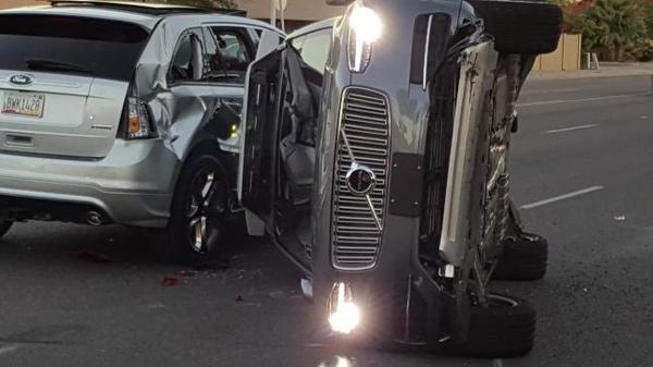 A self-driven Volvo SUV owned and operated by Uber flipped on its side after a collision in Tempe, Arizona.   Courtesy FRESCO NEWS/Mark Beach