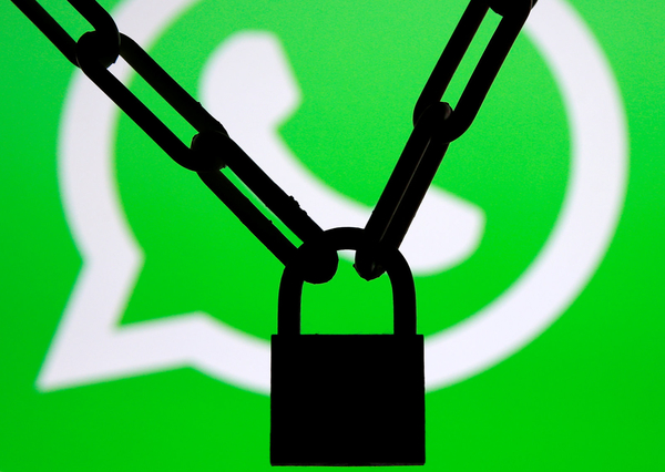 A photo illustration shows a chain and a padlock in front of a displayed Whatsapp logo January 13, 2017. REUTERS/Dado Ruvic/Illustration